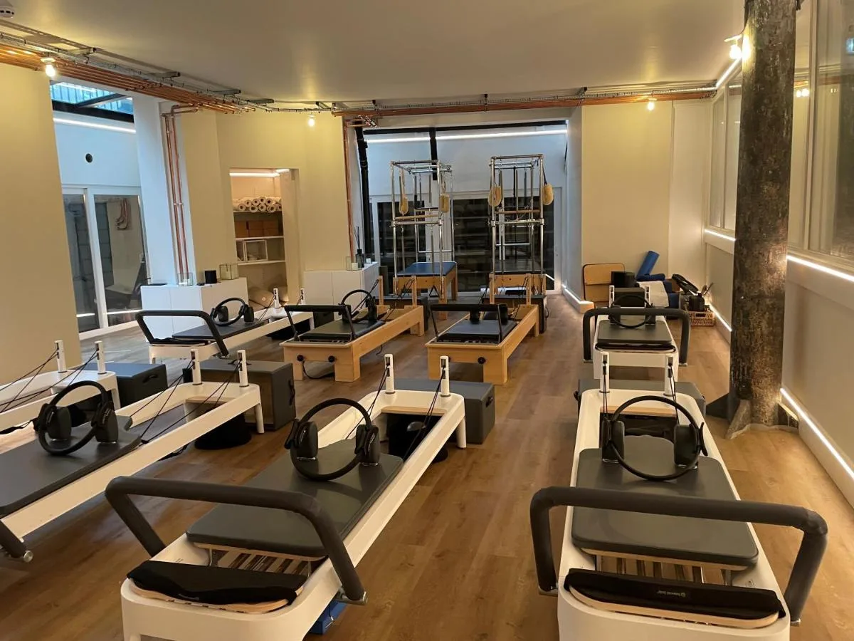a room with rows of beds in a salon at The Harrington - Gloucester Road - 1 Harrington Gardens in London